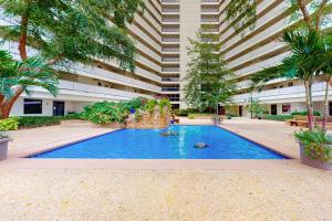 Wonderful beachfront condo with pools gym sauna AC & balcony