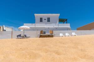 Two beachfront semi detached villas on the sand