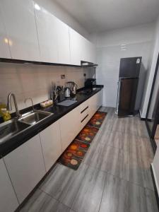 modern serenity suites apartments with swimming pool,modern equipped gym,private parking space, children playing ground, proximity to major shopping malls and unbeatable city views