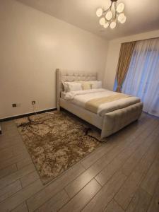 modern serenity suites apartments with swimming pool,modern equipped gym,private parking space, children playing ground, proximity to major shopping malls and unbeatable city views