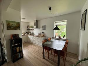 A Reykjavík home with books and a sunset view