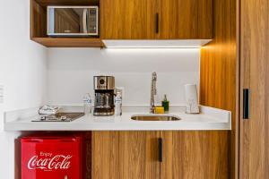 Modern oceanfront studio with breathtaking sunsets, heated pools & beach access