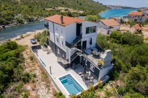 Beachfront Villa Marivi with Pool, Jacuzzi and Game Room