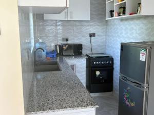 J & T Holme Apartment