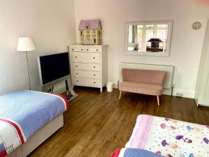 2 BEDROOM FAMILY APARTMENT, Private Car Space & Garden & Entrance , in front of the Pier & Beach , Bedroom1 Double bed ,Bedroom 2 , 3 single beds
