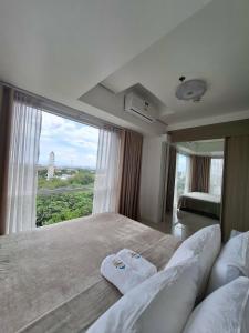 De Luxe, Standard and Studio Suites -The Breeze Residences-close to Airport,Mall of Asia, US Embassy