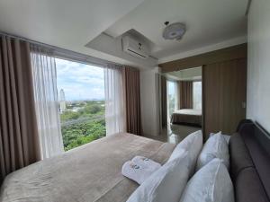 De Luxe, Standard and Studio Suites -The Breeze Residences-close to Airport,Mall of Asia, US Embassy