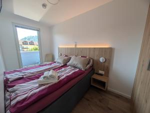 See 12 - Wunderschönes Appartement mit Balkon und privatem Seezugang