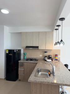 Lindo Apartamento completo, piscinas, BBQ y terraza