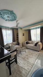 White apartment next to Twin palms apartment