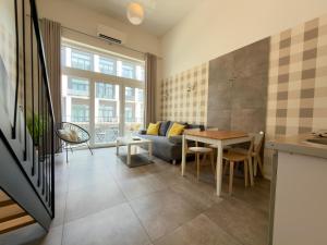Wrocław Airport Apartment with Mezzanine by BookingHost
