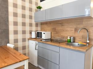 Wrocław Airport Apartment with Mezzanine by BookingHost