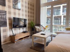 Wrocław Airport Apartment with Mezzanine by BookingHost