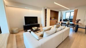 Spacious family duplex with sunny terrace near the beach