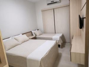 Estadia & Conforto - Ar, WiFi, Garagem, Praia 600m