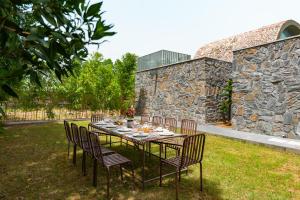 Earthstone 4-BHK Stone-Clad Villa with Private Pool, Terrace Garden & Gazebo