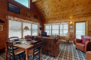 Two lakefront dog-friendly cabins on four acres with porches, dock, & lake views