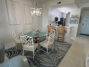 Luxurious oceanfront condo with private balcony, 2 pools, and beach access