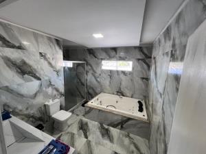 Casa com Hidromassagem Quente e Fria