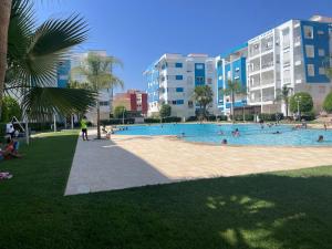 Elegant apartment inside the Arena Martil complex with a pool and many amenities