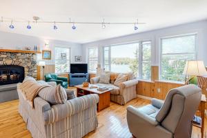 Secluded waterfront home with firepit, gas grill, kayaks, dock, balcony, & patio