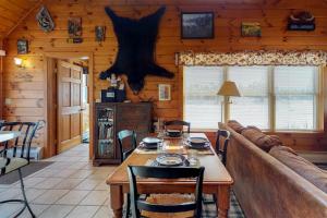 Two lakefront dog-friendly cabins on four acres with porches, dock, & lake views