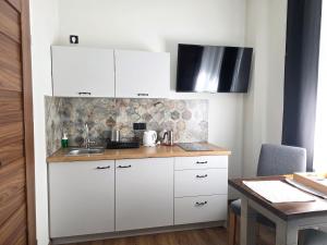 4 STRONY ŚWIATA Pokoje i Apartamenty