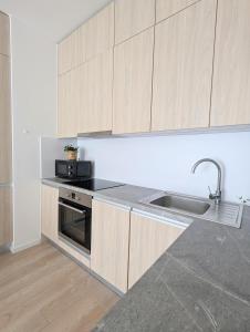 Modern 2-rm apt with Red Light Therapy panel