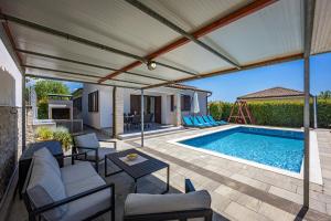 Holiday House Gortan for 7 people near Pula with children playground and heated pool
