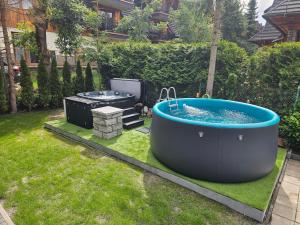 Giewont View Apartamenty z widokiem - Seven & Sauna, Jacuzzi, Basen - Grunwaldzka Krupówki Centrum Zakopane by RentiloPL