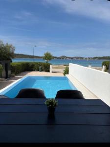Apartment Lydia with private pool on the beach