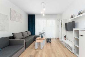 Cozy Studio with a Balcony and Parking by Noclegi Renters