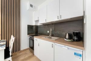 Cozy Studio with a Balcony and Parking by Noclegi Renters