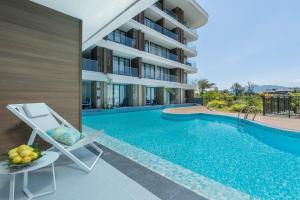 Modern Pool Access Condo At Beachfront Bang Tao Beach