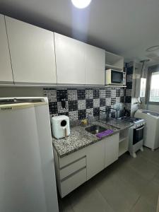 Apartamento Barra Olímpica com cozinha e garagem