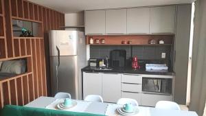 Lindo Flat 105-FM20 com vista para o mar e estacionamento grátis