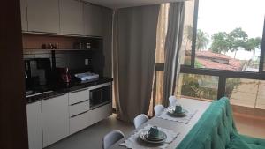 Lindo Flat 105-FM20 com vista para o mar e estacionamento grátis