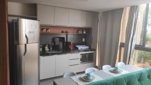 Lindo Flat 105-FM20 com vista para o mar e estacionamento grátis