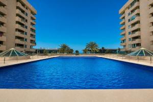 50 meters from the beach, with a pool and balcony
