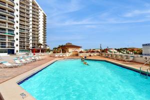 Gulf-view resort condo with pool hot tubs & over-street beach access