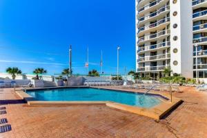 Cozy beachfront condo with shared pool and easy beach access