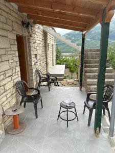 Traditional stone house with a view of the river and the mountain