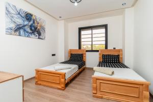 Appartement 2 BDR Avec Piscine et espace de jeux Immi Ouaddar