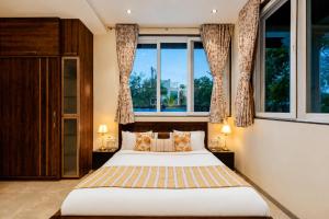 ELIVAAS Signature AARAA VILAS 4-BHK Luxury Pool Villa with Home Theatre, Sports Court & Panoramic Hill Views