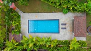 ELIVAAS Signature AARAA VILAS 4-BHK Luxury Pool Villa with Home Theatre, Sports Court & Panoramic Hill Views