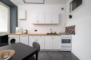 Tyszkiewicza Pleasant Apartment by BookingHost