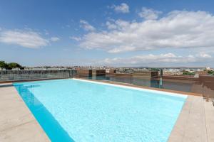 Luxury Living with Rooftop Pool and Garage by HostWise