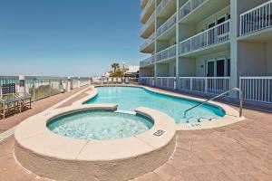 Gulf-front getaway with pools beach access new floors & appliances