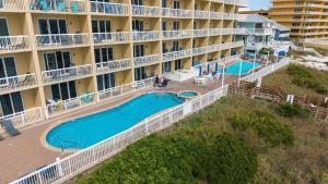 Gulf-front getaway with pools beach access new floors & appliances