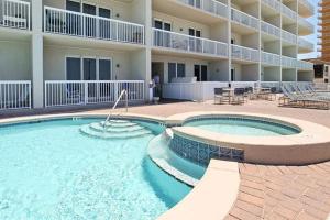 Sunny eighth-floor beachfront condo with pools hot tub & fitness room